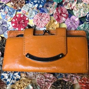 Orange Hobo wallet with magnetic closure